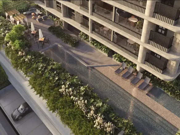 Vista aérea da área de lazer com piscina, deck e jardins do empreendimento Fascino Consciente.