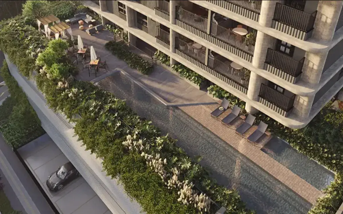 Vista aérea da área de lazer com piscina, deck e jardins do empreendimento Fascino Consciente.