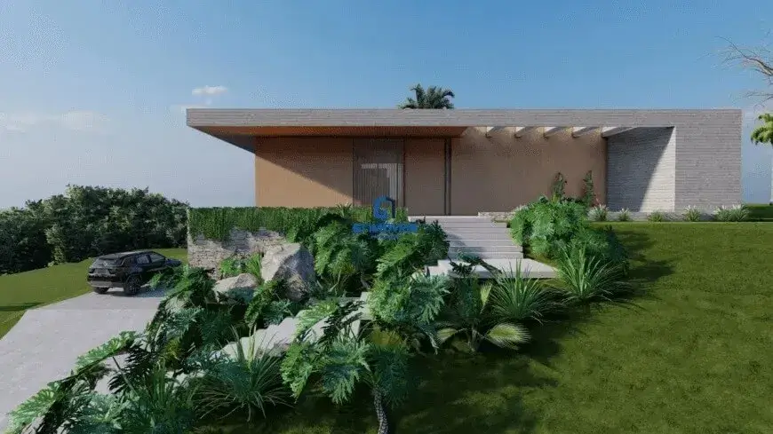 A imagem exibe uma residência de arquitetura contemporânea e linhas puras, caracterizada por um design horizontalizado que se assenta com elegância sobre um terreno em aclive. O céu de um azul intenso e sem nuvens sugere um dia de luminosidade plena, realçando cada detalhe da construção e do paisagismo. Detalhes Estruturais e Revestimentos do Imóvel: A fachada principal da casa é dominada por uma grande laje de cobertura plana que se projeta audaciosamente para a frente, formando uma generosa marquise. Esta marquise, revestida em um tom de cinza muito claro ou possivelmente um acabamento que imita madeira clara, cria uma área de sombra e transição para a entrada. Sustentando visualmente essa projeção, percebem-se pilares delgados ou extensões da parede principal, pintados no mesmo tom da fachada. A parede principal sob a marquise apresenta um revestimento liso em um tom bege suave, quase creme, conferindo uma base neutra e sofisticada. À direita da entrada, uma parede lateral se destaca por um revestimento texturizado em réguas horizontais de cor cinza claro, com variações sutis de tonalidade, lembrando pedras naturais finas como canjiquinha ou um concreto aparente trabalhado. Este contraste de texturas e cores adiciona profundidade e interesse visual à composição. A entrada principal é acessada por uma imponente escadaria de concreto claro, com degraus largos e baixos que convidam ao acesso. A porta de entrada, alta e centralizada, é um elemento de destaque, parecendo ser constituída por um grande painel de vidro com esquadrias metálicas escuras ou, alternativamente, um painel ripado vertical de madeira escura, conferindo um toque de modernidade e privacidade. Ambiente, Paisagismo e Elementos Externos: O ambiente é de exclusividade e integração com a natureza. O terreno em aclive é habilmente trabalhado com um paisagismo exuberante. Um vasto gramado de um verde vibrante e meticulosamente aparado cobre a maior parte da área frontal e lateral, ascendendo em direção à edificação. O projeto paisagístico é rico em espécies de folhagens densas e variadas. Na base da casa e margeando a escadaria, observam-se arranjos de plantas tropicais, como filodendros de folhas largas e recortadas, pequenas palmeiras ornamentais e arbustos volumosos de diferentes tonalidades de verde. Muros de contenção baixos, construídos com pedras naturais rústicas de coloração clara (bege-acinzentado), acompanham o desnível do terreno. Sobre estes muros, vegetação pendente e rasteira se derrama, suavizando as linhas e integrando as estruturas de pedra ao verde circundante. À esquerda da imagem, uma rampa de acesso para veículos, pavimentada em concreto claro e liso, desce em direção à parte mais baixa do terreno. Um veículo SUV de porte médio a grande, na cor preta ou cinza chumbo, está estacionado ao final desta rampa, sugerindo a entrada da garagem ou uma área de estacionamento. Ao fundo, delimitando visualmente a propriedade, uma densa massa de árvores altas com copas frondosas forma um pano de fundo verde escuro, garantindo privacidade e reforçando a sensação de imersão na natureza. Nota-se, à extrema direita e mais distante, o tronco nu de uma árvore, talvez uma espécie caducifólia. Cores Predominantes: A paleta de cores é sofisticada e harmoniosa: Construção: Bege claro/creme nas paredes principais, cinza claro na marquise e na parede texturizada. Paisagismo: Múltiplos tons de verde (do claro ao escuro), marrons e cinzas das pedras e troncos. Acessos: Cinza claro do concreto. Céu: Azul intenso. Móveis: Nesta perspectiva da fachada e do jardim frontal, não são visíveis quaisquer peças de mobiliário externo, como mesas, cadeiras ou espreguiçadeiras. O foco está inteiramente na arquitetura imponente do imóvel e na sua integração com o paisagismo cuidadosamente planejado. Em suma, a imagem retrata uma propriedade de alto padrão no Residencial Aldeia do Vale, onde a arquitetura moderna se funde com um paisagismo tropical exuberante, transmitindo uma atmosfera de luxo, tranquilidade e contato íntimo com a natureza.