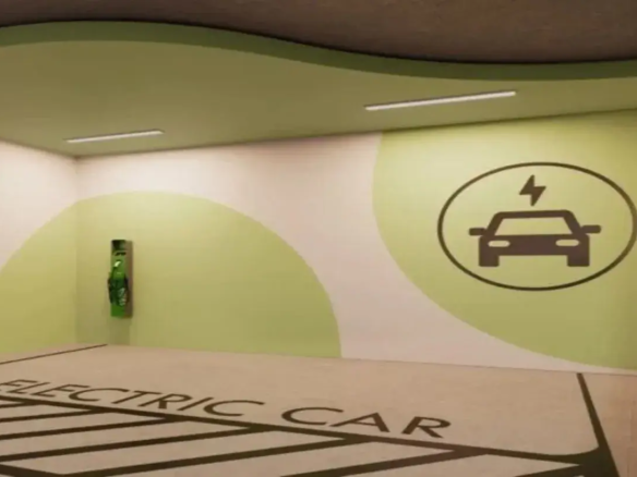 A imagem mostra uma vaga de estacionamento interna, especificamente designada para o carregamento de veículos elétricos. O espaço é bem iluminado por duas luminárias de teto longas e retangulares, de luz branca. O piso da vaga é de cor clara, possivelmente concreto polido ou epóxi cinza claro, e possui marcações proeminentes em cinza escuro ou preto. Na parte mais próxima do observador, lê-se em letras maiúsculas "ELECTRIC CAR". Abaixo do texto, faixas diagonais preenchem a área da vaga, delimitando claramente o espaço reservado. As paredes são predominantemente brancas, mas decoradas com grandes formas curvas pintadas em um tom de verde claro, quase pistache. Na parede do fundo, à esquerda, está instalada a Estação de Recarga para Veículos Elétricos. É um equipamento vertical, de cor verde vibrante, montado na parede, com o que parece ser um cabo de carregamento enrolado ou pendurado na sua frente. Na parede da direita, uma grande forma circular em verde claro serve de fundo para um símbolo universal de carregamento de veículos elétricos: um ícone estilizado de um carro (visto de frente) com um símbolo de raio (eletricidade) acima dele, tudo dentro de um círculo, em cor cinza escuro ou preto. O teto é predominantemente branco, mas acompanha a parede do fundo com uma faixa curva rebaixada ou saliente, também pintada em verde claro, que segue a linha ondulada da decoração da parede, conferindo um design moderno e coeso ao ambiente. A atmosfera geral é limpa, funcional e claramente sinalizada para sua finalidade. Palavra chave: Apartamento com 2 Quartos a Venda Azure Compact Life Marista