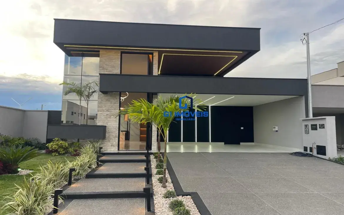 Fachada de casa moderna com design imponente, iluminação LED e paisagismo no Parqville Pinheiros.