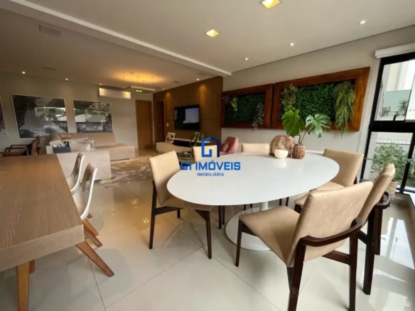 Área de jantar integrada com mesa redonda e vista para cidade no Maxxi 135.