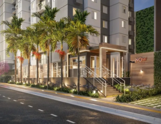 Fachada noturna do empreendimento Now Praça C8 com iluminação moderna e paisagismo, no Setor Sudoeste, Goiânia.