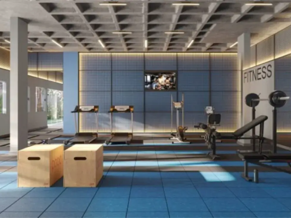 Academia do prédio equipada com esteiras, bicicletas ergométricas e aparelhos de musculação em piso emborrachado.