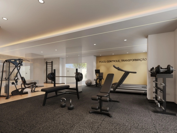 Academia do condomínio espaçosa e equipada com esteiras, pesos livres e aparelhos de musculação.