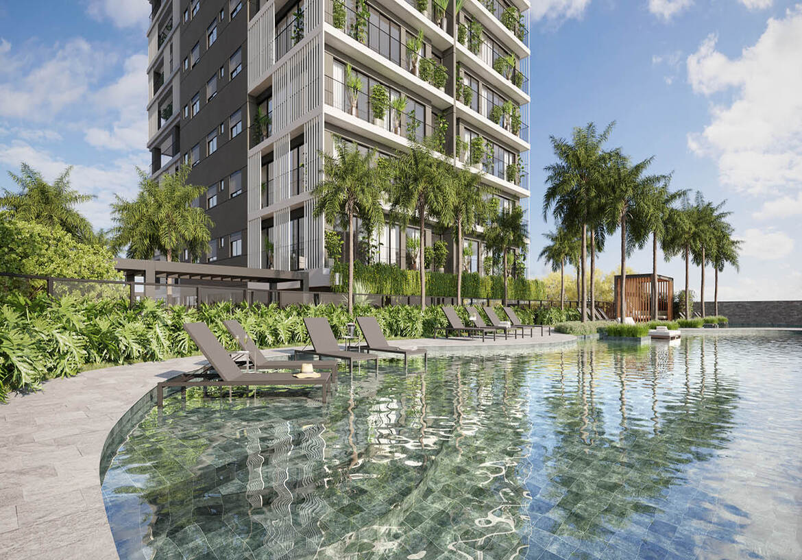 area-lazer-piscina-fachada-edificio Área de lazer com piscina, espreguiçadeiras e vista para a fachada contemporânea com jardins verticais.