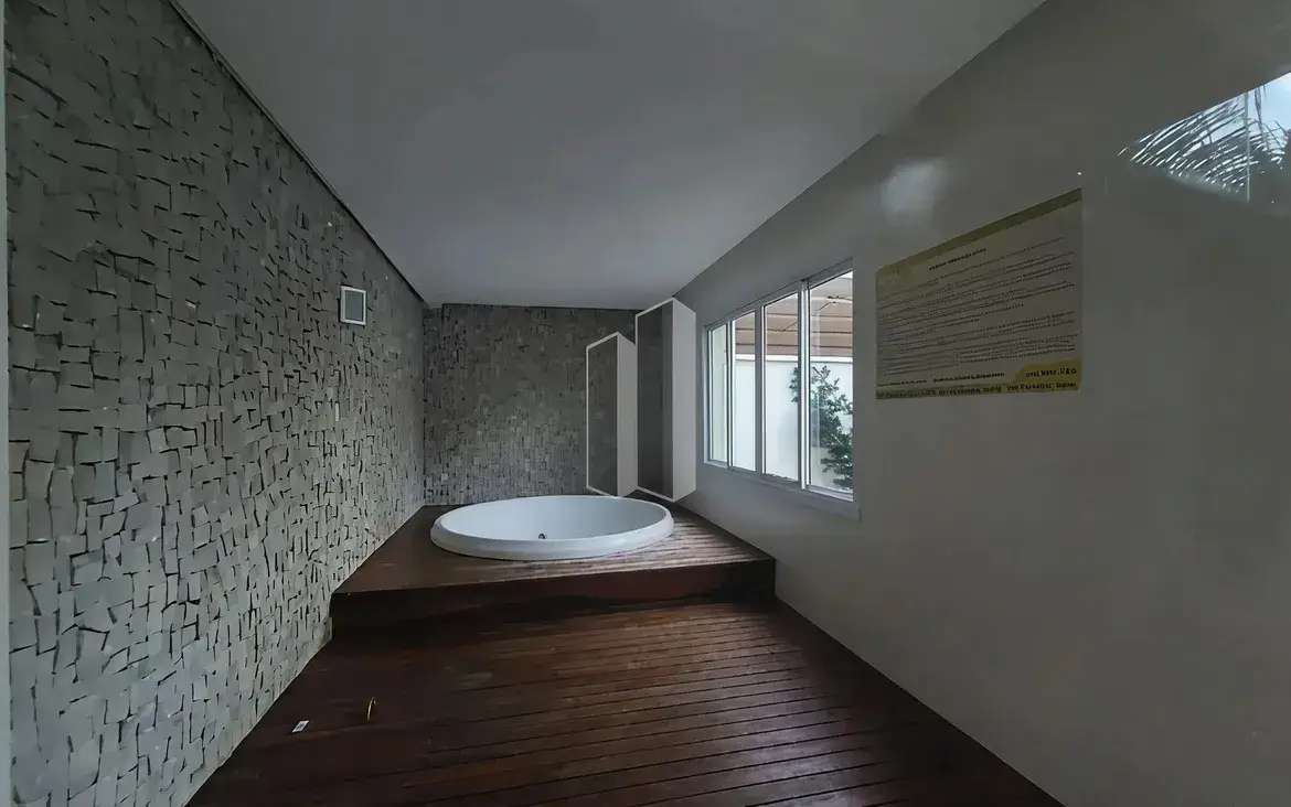 Sala de relaxamento com jacuzzi redonda e deck de madeira no Condomínio Residencial You.