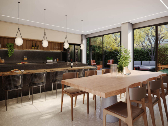 Cozinha compartilhada elegante com mesa de madeira maciça e iluminação pendente moderna.