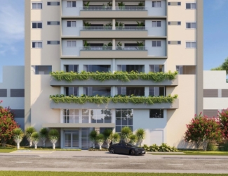 Fachada frontal moderna do edifício Varandas Flamboyant com paisagismo e varandas verdes.