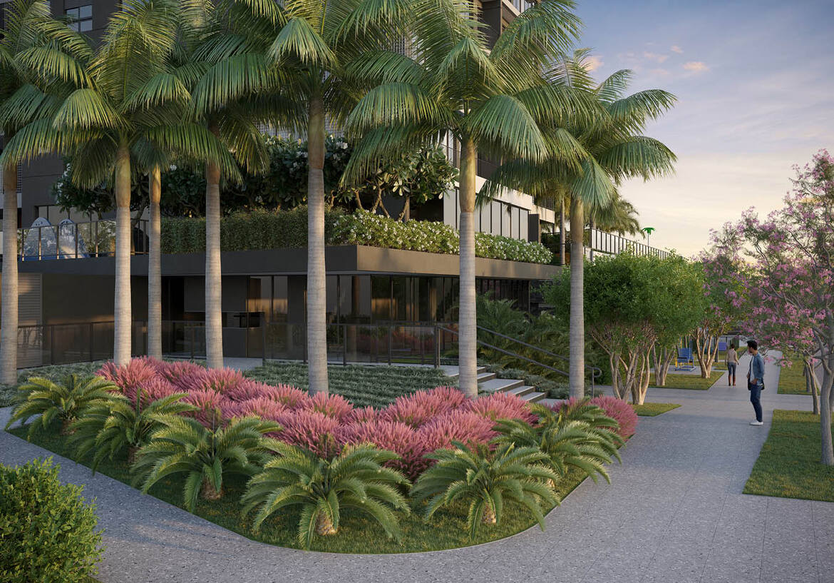 paisagismo-entrada-opus-tellure Paisagismo sofisticado com palmeiras e flores rosadas na entrada do Opus Tellure.
