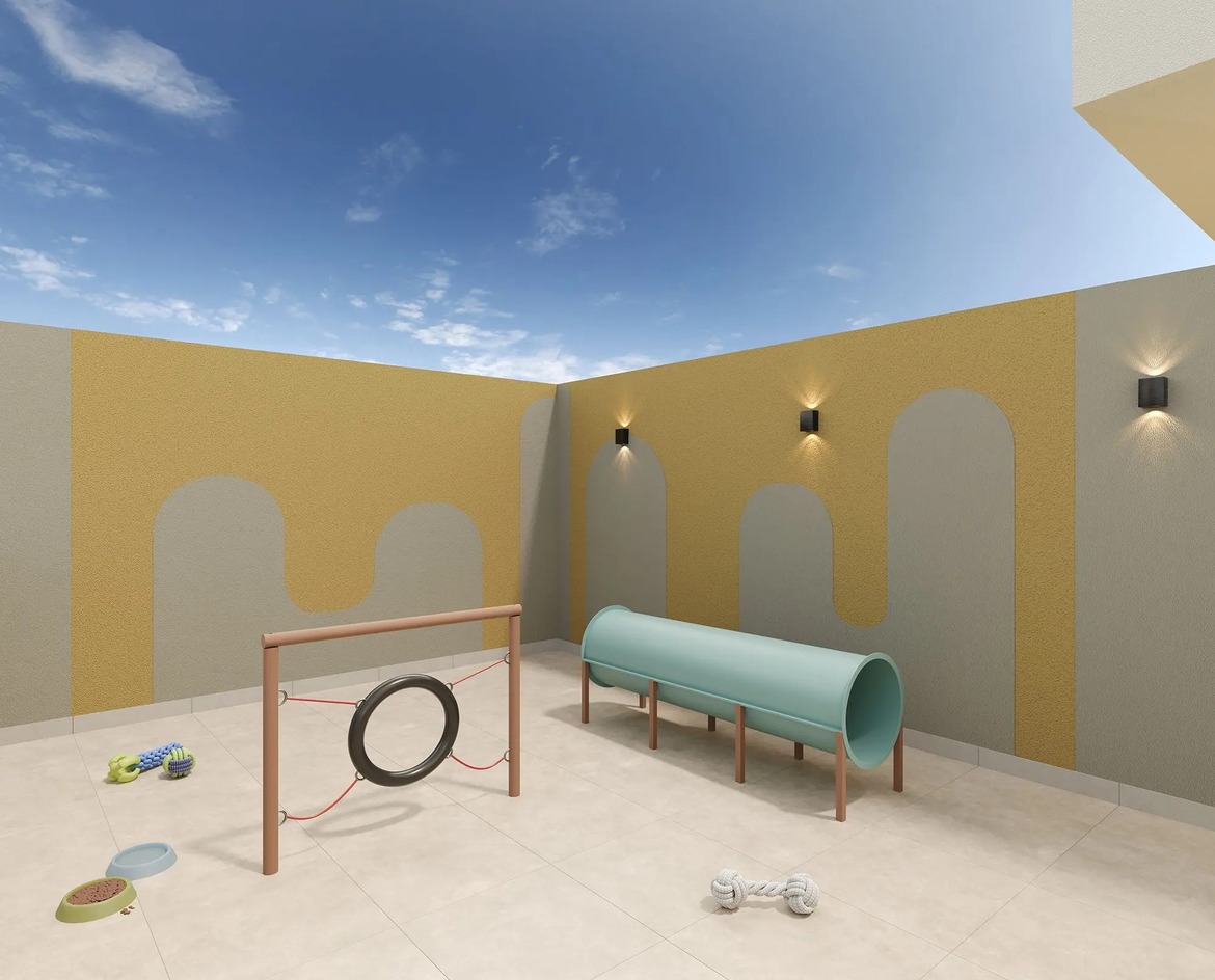 Área de Pet Place com obstáculos de agility, túnel e espaço para recreação de animais de estimação.