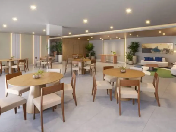 Salão de festas sofisticado do Now Laguna, amplo e mobiliado com mesas e cadeiras confortáveis para eventos.