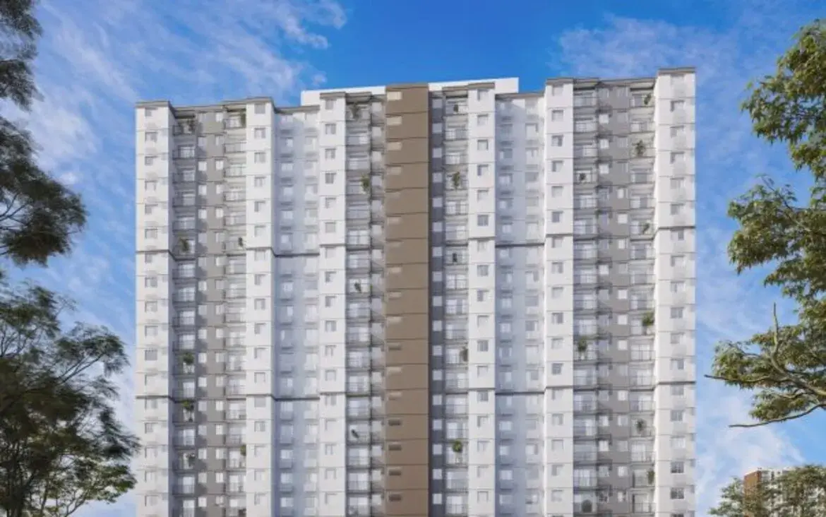 Fachada completa da torre do edifício Now Laguna, destacando a arquitetura contemporânea e janelas amplas.