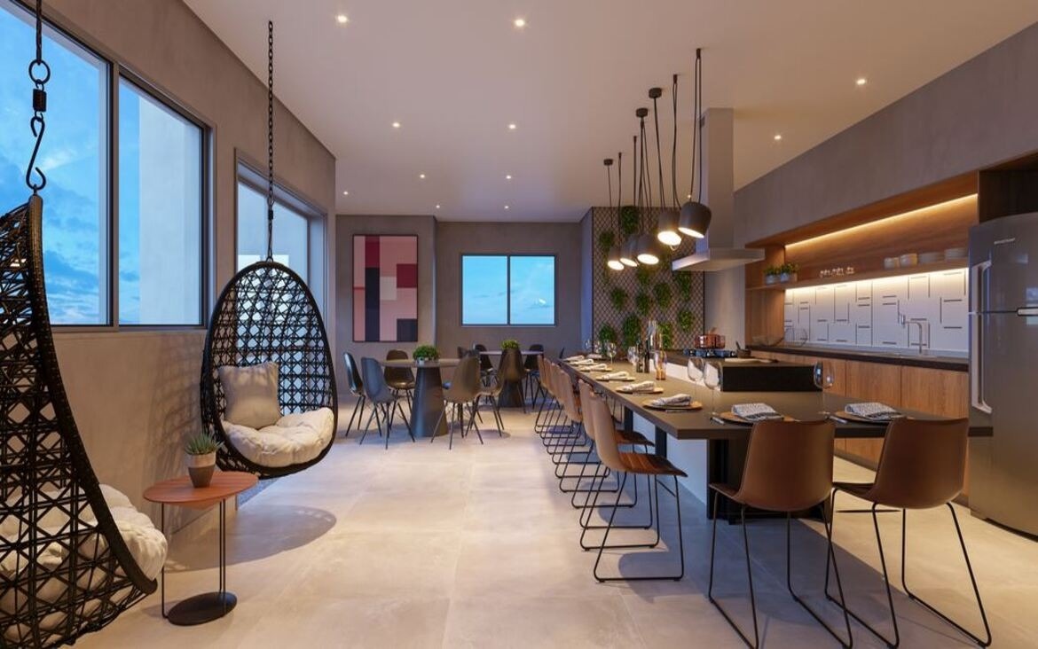 Espaço gourmet decorado com mesa ampla para refeições, ilha de cozinha e cadeiras de balanço suspensas.