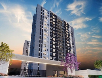 Fachada imponente das torres do empreendimento Chelsea MRV ao pôr do sol.