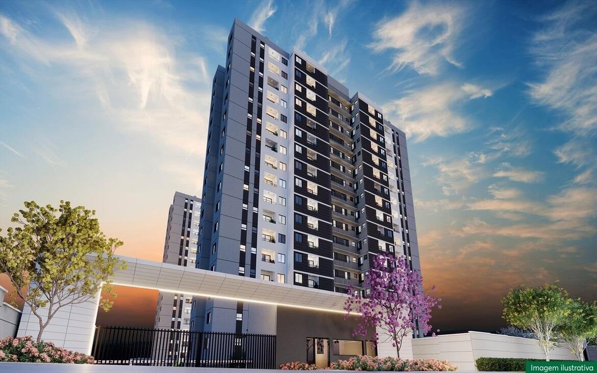 Fachada imponente das torres do empreendimento Chelsea MRV ao pôr do sol.