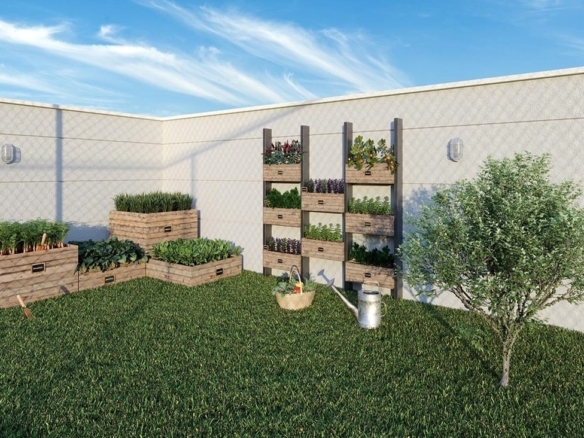 Horta comunitária do condomínio com temperos plantados em caixotes de madeira.