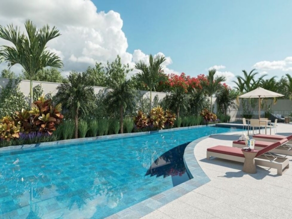 Piscina adulta ao ar livre no condomínio Dot Bild, cercada por espreguiçadeiras e vegetação tropical.