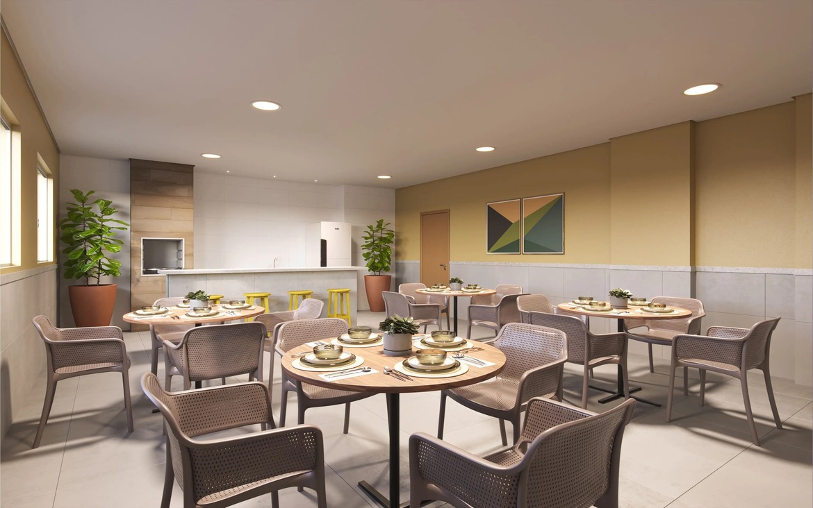 salao-de-festas-area-gourmet Salão de festas elegante com mesas redondas, cadeiras confortáveis e área de buffet ao fundo.