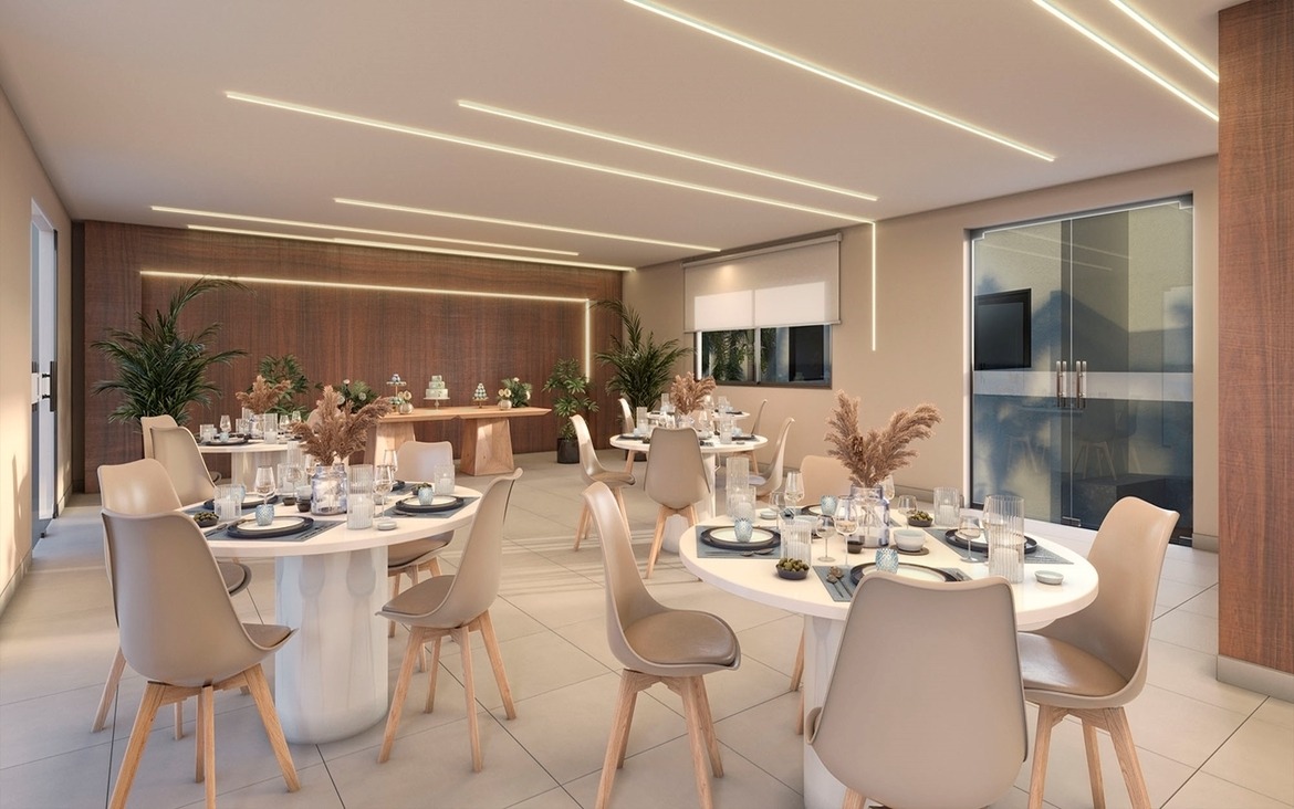 Salão de festas elegante com mesas postas para eventos no Chelsea MRV.