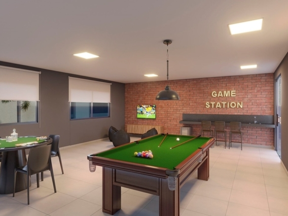 Salão de jogos estilo pub com mesa de sinuca e parede de tijolinhos.