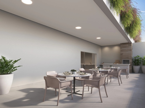 Varanda gourmet com mesas ao ar livre, churrasqueira e jardins suspensos integrados.