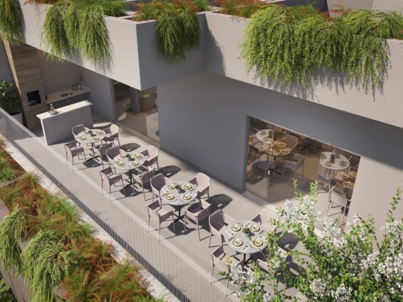 Vista superior da área de lazer externa com mesas e jardins verticais decorativos.
