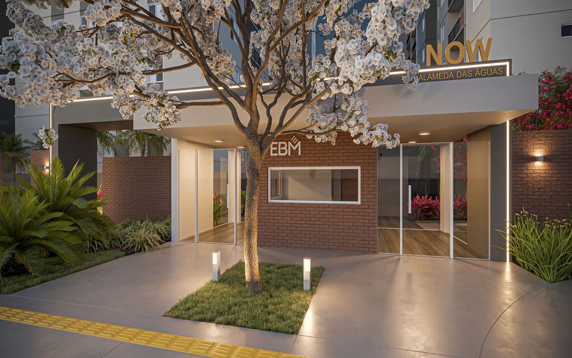 Entrada principal e guarita de acesso ao condomínio residencial com paisagismo moderno e iluminação noturna.