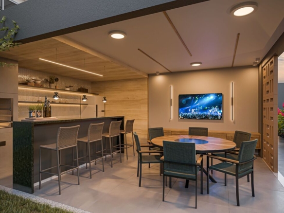 Área de churrasqueira externa coberta com bancada de granito, banquetas e mesa de jantar.