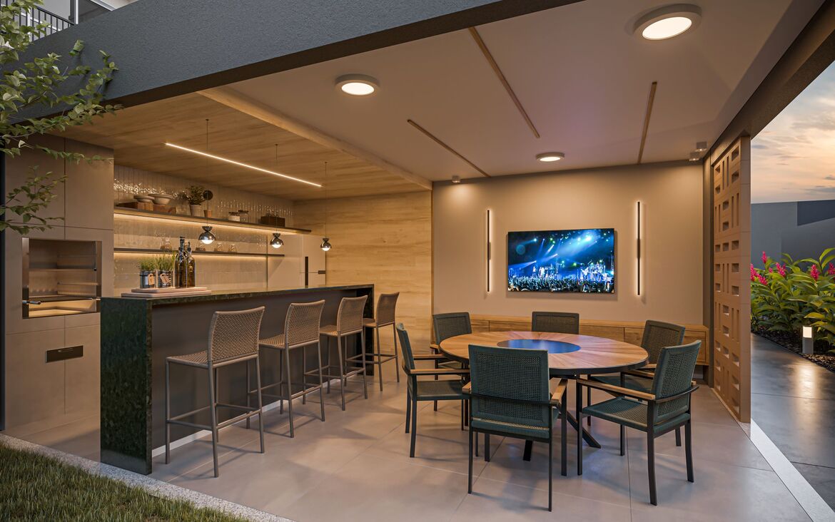 Área de churrasqueira externa coberta com bancada de granito, banquetas e mesa de jantar.