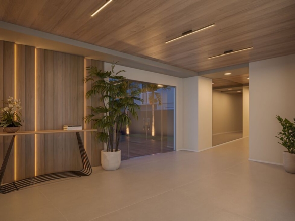 Lobby de entrada elegante para as torres A e B com recepção decorada e acabamento em madeira.
