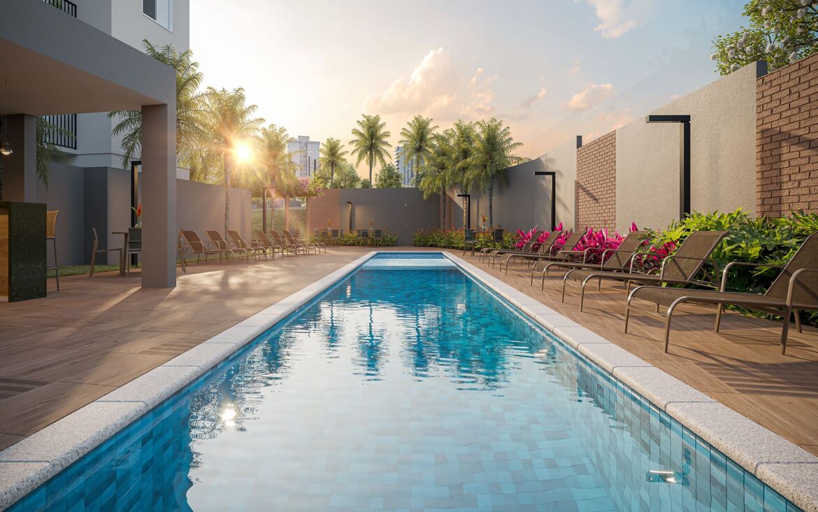 Piscina externa com raia e deck molhado cercada por espreguiçadeiras no Now Alameda das Águas.