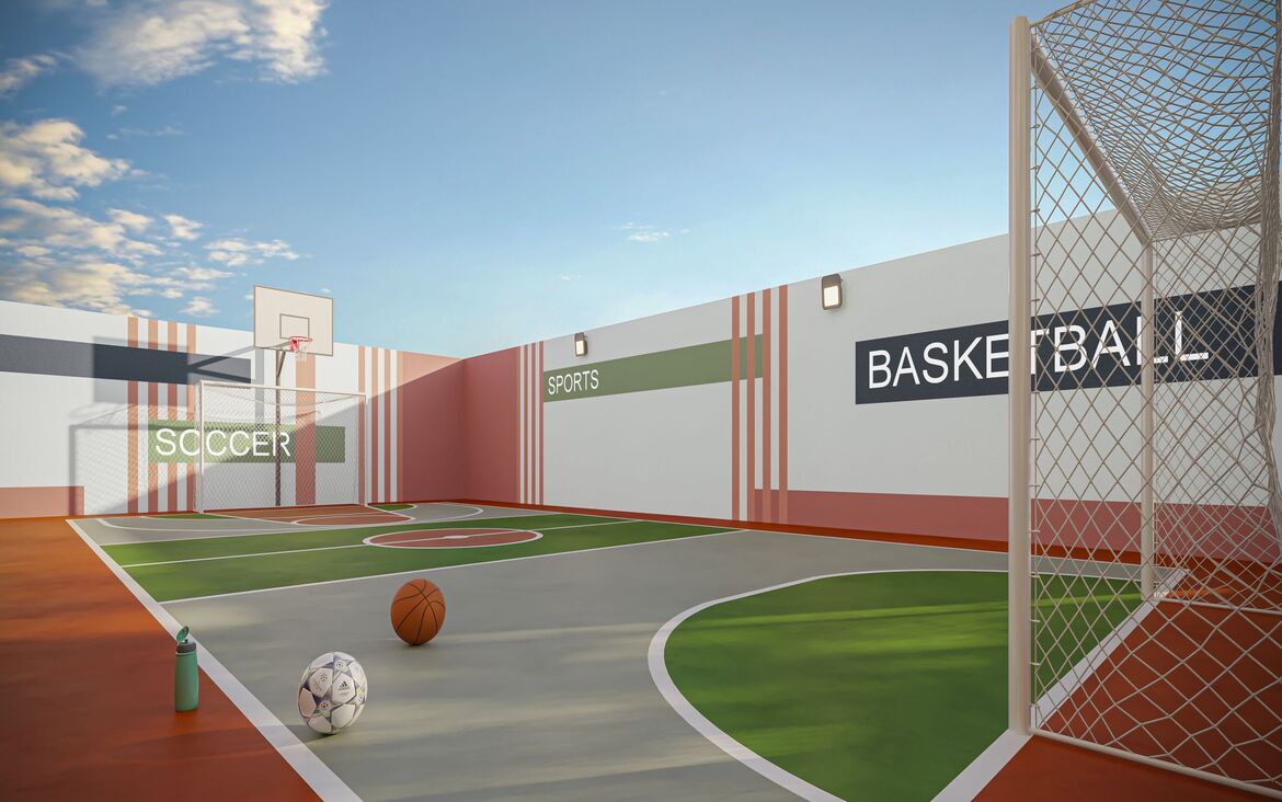 Quadra poliesportiva com marcações para futebol e basquete em ambiente cercado e iluminado.