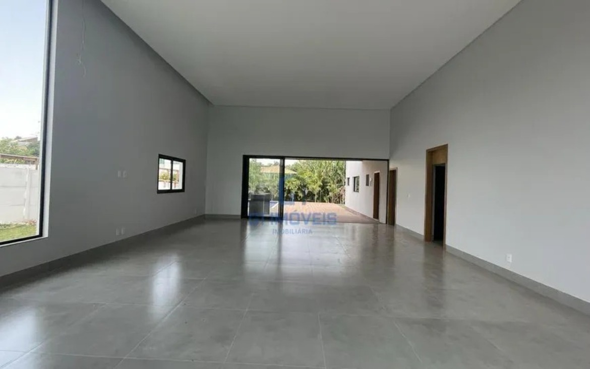 Amplo living integrado com conceito open space, unindo sala de jantar, estar e acesso ao lazer.