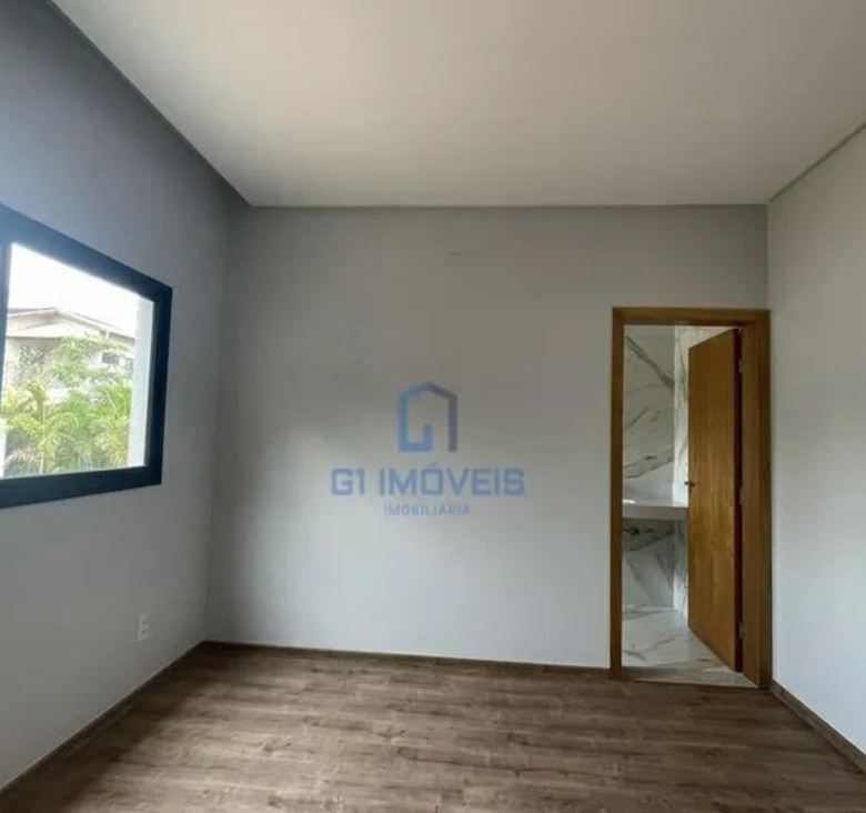 Ambiente íntimo com esquadrias de alumínio preto, garantindo vedação acústica e design moderno.