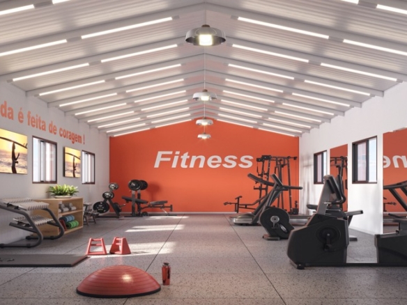 Academia moderna equipada com aparelhos de musculação, esteiras e área para funcional.