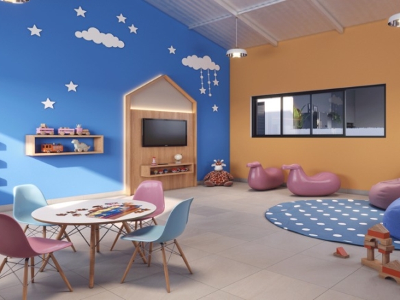 Espaço Kids colorido e decorado com mesas pequenas, pufes e brinquedos educativos no Viva Goiá.